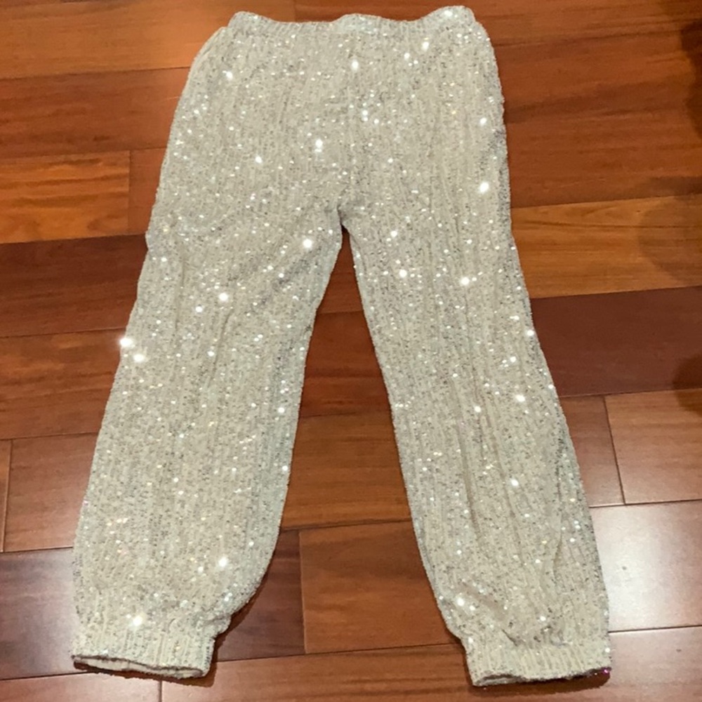 Selling kids L 10/12 shiny pants for $10 from the company Art Class